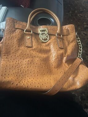 Michael Kors Tan Ostrich-Embossed Satchel with Gold Accents
BEAUTIFUL BAG….